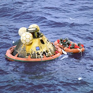 The Columbia floats on the ocean as navy divers assist in retrieving the astronauts.jpg